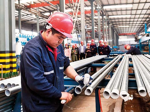 A steel pipe factory in China’s eastern Shandong province. In recent months, authorities have been warning against speculative trading, auctioning off base metals reserves, and launching probes into prices and reserves of iron ore, coal and urea.