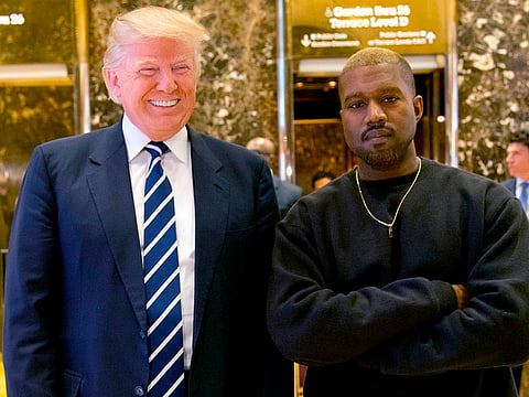 File photo: Then-President-elect Donald Trump and Kanye West pose for a picture in the lobby of Trump Tower in New York in December 2016.