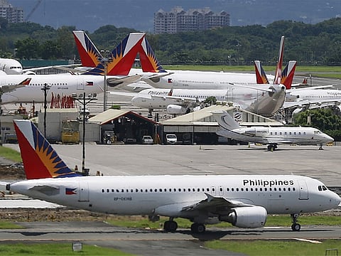 Philippine health authorities directed the Bureau of Quarantine to locate passengers who arrived within 14 days before November 29 from red-listed countries. File photo shows Philippine Airlines planes on the tarmac of Manila's Ninoy Aquino International Airport. 