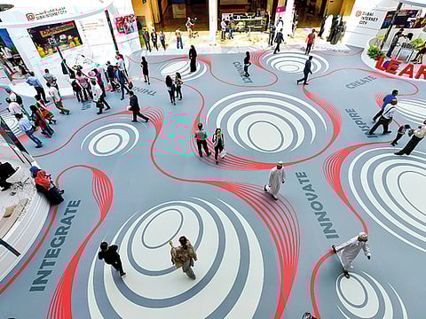 Innovation will be at the heart of the UAE's next economic transition. Be it 'smart' cities or in the delivery of government services, digital and next-generation technology will power the shift.  People at the GITEX Innovation week at Dubai World Trade Centre. 