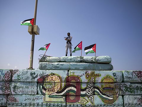 A Palestinian police officer stands guard at the Gaza seaport, in Gaza City (File)