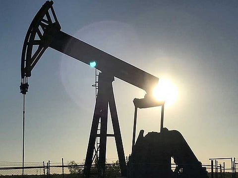 An oil pump jack is seen at sunset near Midland, Texas, U.S. A drop in US oil inventories are expected to provide oil prices with a short-term boost.