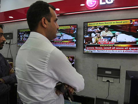 File photo: People at an electronics shop in Jammu, India.