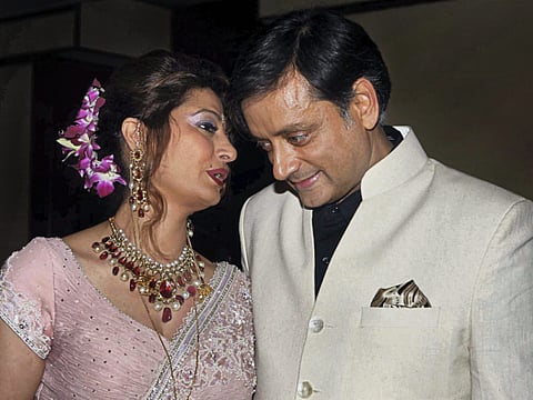 File photo dated September 2010 shows Congress MP Shashi Tharoor with his wife Sunanda Pushkar in New Delhi