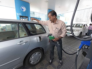 Motorists train for self-service at petrol pumps