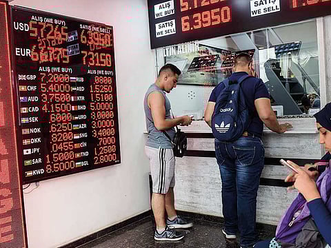 A currency exchange in Istanbul. Turkey’s lira hit an all-time low against the dollar on Friday, a day after the central bank unexpectedly cut interest rates.