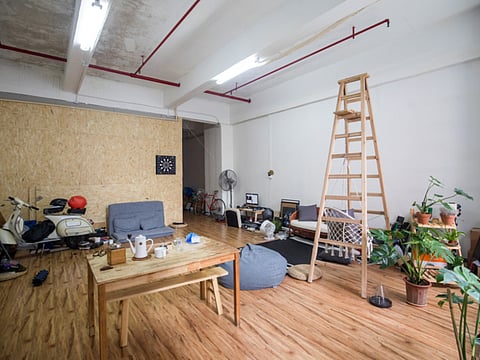 Furniture and personal possessions in the living room of an apartment 