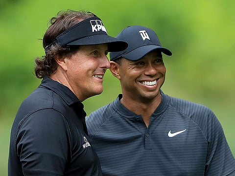 Phil Mickelson, left, and Tiger Woods
