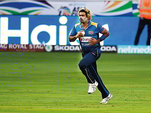 Lasith Malinga of Sri Lanka bowls against Bangladesh in the opening match on Saturday. The pacer bowled an impressive spell to claim four wickets in his 10 overs.