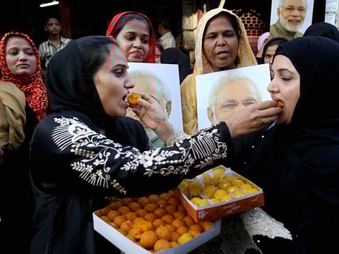 A file photo from 2017 shows Muslim women celebrate the Supreme Court's decision on "Triple Talaq".