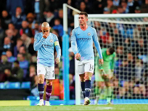 Manchester City’s Aymeric Laporte, right, is out injured