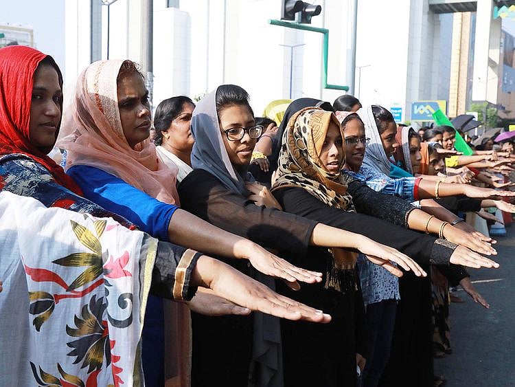 Women hold out their hands