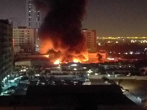 Residents reported thick black plume of smoke billowing over Sharjah's industrial district.