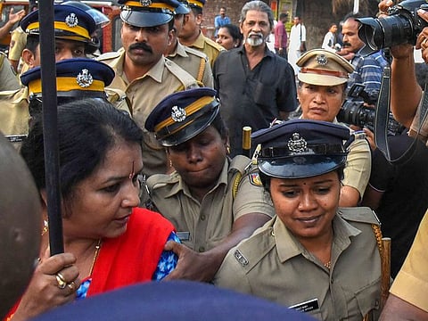 Police arrest BJP workers in connection with a protest of Sabarimala women entering, in Kochi.