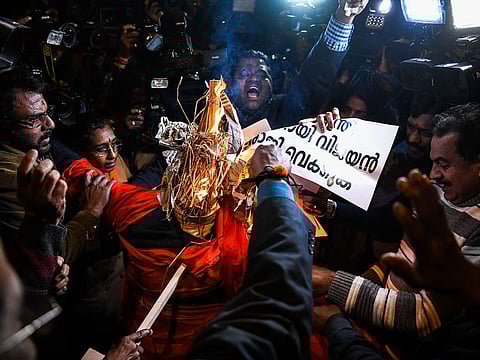 Indian Hindu activists burn effigy of Chief Minister of Kerala Pinarayi Vijayan during a demonstration over two women entering the Sabarimala Ayyapa temple in the southern state of Kerala, in New Delhi on January 3, 2019.