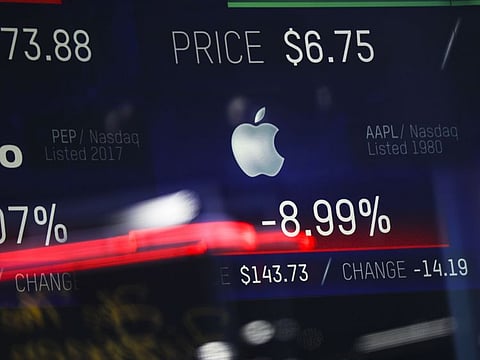 Stock numbers for Apple are displayed on a screen at the Nasdaq MarketSite in Times Square, January 3, 2019 in New York City.
