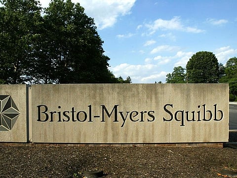 a sign stands in front of a Bristol-Myers Squibb building in a Lawrence Township, New Jersey.