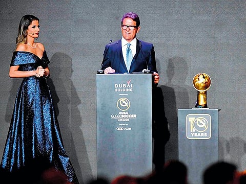 Italian former professional football manager, Fabio Capello (C) speaks after receiving a "Coach Career Award" during the 10th edition of the Dubai Globe Soccer Awards on January 3, 2019 in Dubai. 