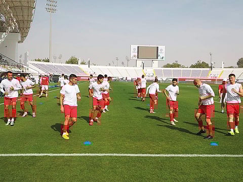 Kyrgyzstan team take part in a training session on Sunday ahead of their Asian Cup match in Al Ain.