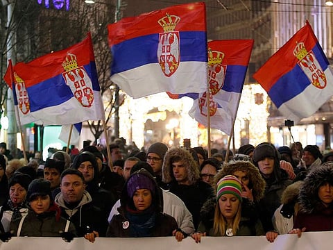 People march during a protest against populist President Aleksandar Vucic in Belgrade, Serbia, Saturday, Jan. 5, 2019. 