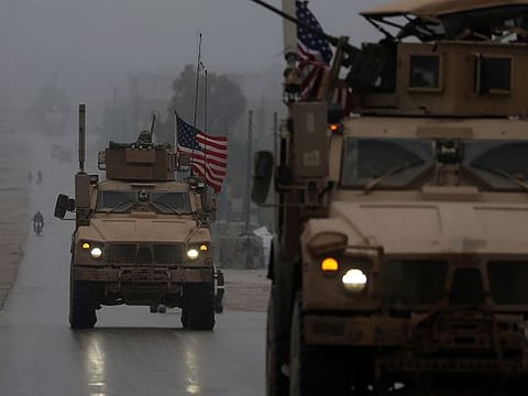 A line of US military vehicles in Syria's northern city of Manbij.