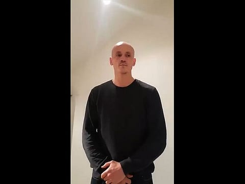 Former boxer Christophe Dettinger broacasting a message of apology for punching police officers during a "yellow vest" protest in Paris