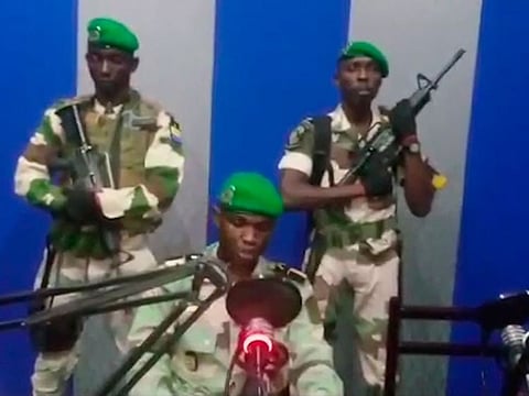 In this image from TV, a soldier who identified himself as Lt. Obiang Ondo Kelly, commander of the Republican Guard, reads a statement on state television broadcast from Libreville, Gabon, saying the military has seized control of the government, Monday Jan. 7, 2019.  