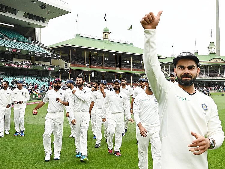 India's captain Virat Kohli (R) gestures
