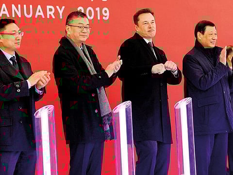 Tesla CEO Elon Musk (second from right) with Chinese officials during the groundbreaking ceremony in Shanghai on Monday. 