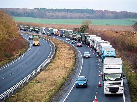 Trucks sit stacked on a highway en-route to Dover from Manston Airport as they participate in a trial as part of the UK Government’s “Project Brock”, Brexit operations across Kent, near Manston, UK.