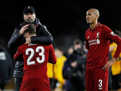 Liverpool manager Juergen Klopp, Xherdan Shaqiri and Fabinho react after the match