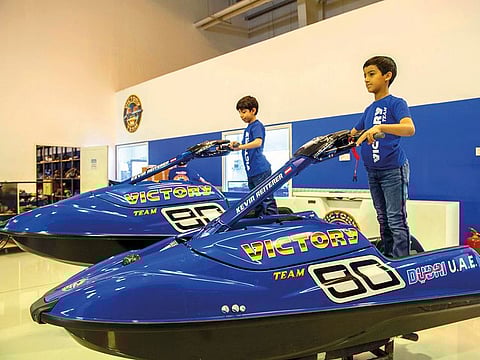 Hamdan Saeed Al Harbi (right) and Suhail Rashid Al Tayer get on to their brand-new jet skis at the Victory Team headquarters in Jebel Ali.