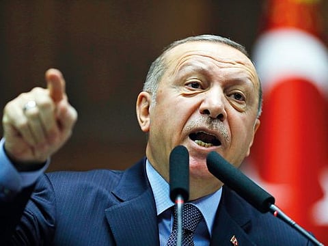 Turkey's President Recep Tayyip Erdogan gestures as he delivers a speech 