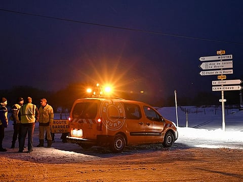 French police closed a road on January 9, 2019 outside Mignovillard, central-eastern France, after the crash of an Air Force Mirage 2000 fighter in the area.