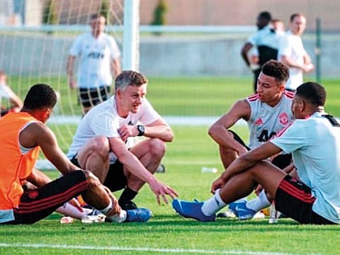 Manchester United boss Ole Gunnar Solskjaer (centre left) passes on some tips to Marcus Rashford (left), Jesse Lingard (centre right) and Anthony Martial (right). 