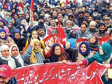 Leaders and members of the Centre of Indian Trade Unions (CITU) march in Srinagar, Jammu and Kashmir yesterday. 
