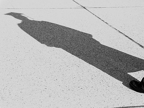 A silhouette of a graduate.