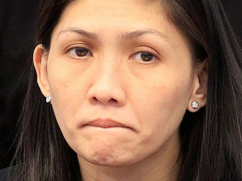 Maia Santos Deguito, a branch manager of the Rizal Commercial Banking Corp (RCBC) reacts during a money laundering hearing at Senate in Manila March 15, 2016.