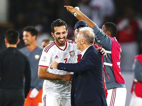 UAE’s Ali Mabkhout celebrates scoring their second goal with coach Alberto Zaccheroni during their Group A match against India at the Zayed Sports City Stadium on Thursday.