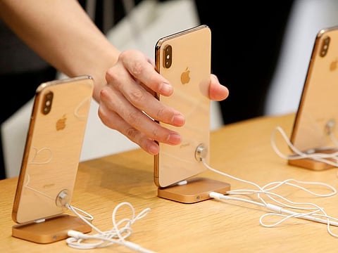 People look at  iPhones at the World Trade Center Apple Store during a Black Friday sales event in Manhattan, New York City, U.S., Nov. 23, 2018.