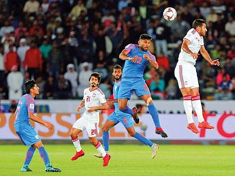 India's defender Anas Edathodika, second right, heads the ball past United Arab Emirates' forward Ali Mabkhout al Hajeri, right, during the AFC Asian Cup group A soccer match between United Arab Emirates and India at Zayed Sports City Stadium in Abu Dhabi, United Arab Emirates, Thursday, Jan. 10, 2019.