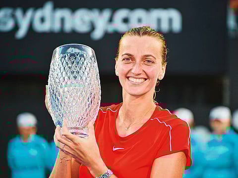 Petra Kvitova of the Czech Republic holds the trophy after beating Australia's Ashleigh Barty in the women's final match at the Sydney International tennis tournament in Sydney on January 12, 2019.