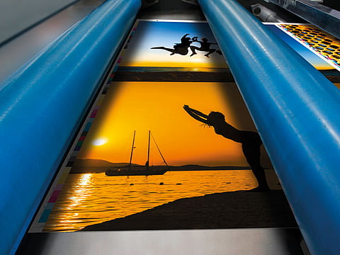 Close up of an offset printing machine rollers during production