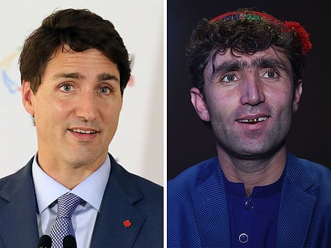 Canada's Prime Minister Justin Trudeau (left) and Abdul Salam Maftoon, an Afghan singer and contestant of the television music competition 'Afghan Star'