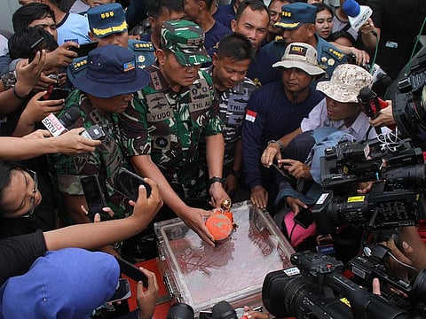 A cockpit voice recorder, the second "black box" from Lion Air flight 610 that crashed last October killing all 189 people onboard, is displayed to the media by Indonesian Navy personnel after the device's recovery at sea off the coast of Karawang.