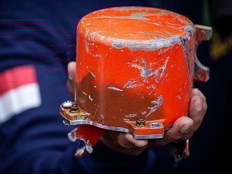 Indonesia's National Transportation Safety Committee (KNKT) officer shows a cockpit voice recorder (CVR) of a Lion Air JT610 that crashed into Tanjung Karawang sea, on the deck of Indonesia's Navy ship KRI Spica-934 at Karawang sea in West Java, Indonesia.
