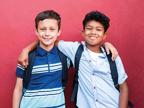 Portrait of multiethnic schoolboys enjoying friendship.