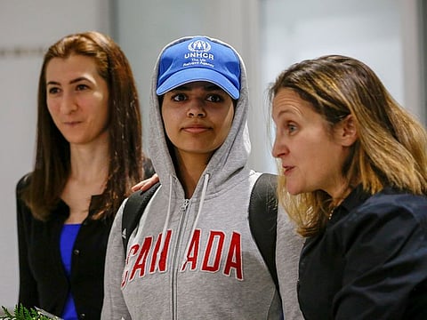 Rahaf Mohammed al-Qunun (C) accompanied by Canadian Minister of Foreign Affairs Chrystia Freeland (R) and Saba Abbas, general counsellor of COSTI refugee service agency, arrives at Toronto Pearson International Airport in Toronto, Ontario, Canada.
