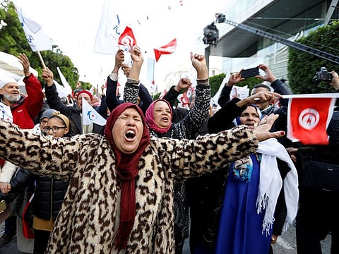 Women take part in a demonstration marking the eighth anniversary of the 2011 uprising that unseated former president Zine El Abidine Ben Ali, in Tunis. 
