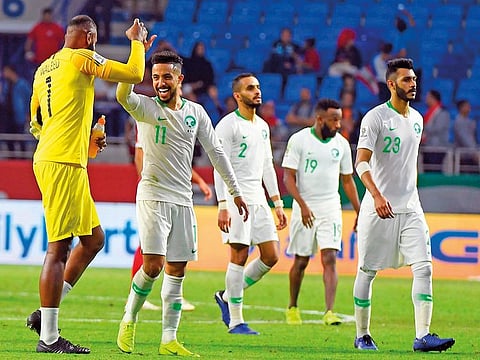 Saudi Arabian players celebrate after winning the 2019 AFC Asian Cup Group E match against Lebanon in Dubai on Saturday. The Green Falcons are confident of a win today. 